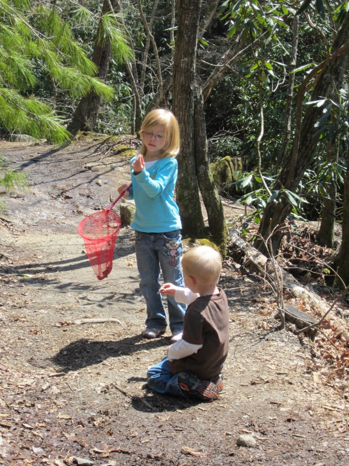Addie and her brother exploring together on the trail