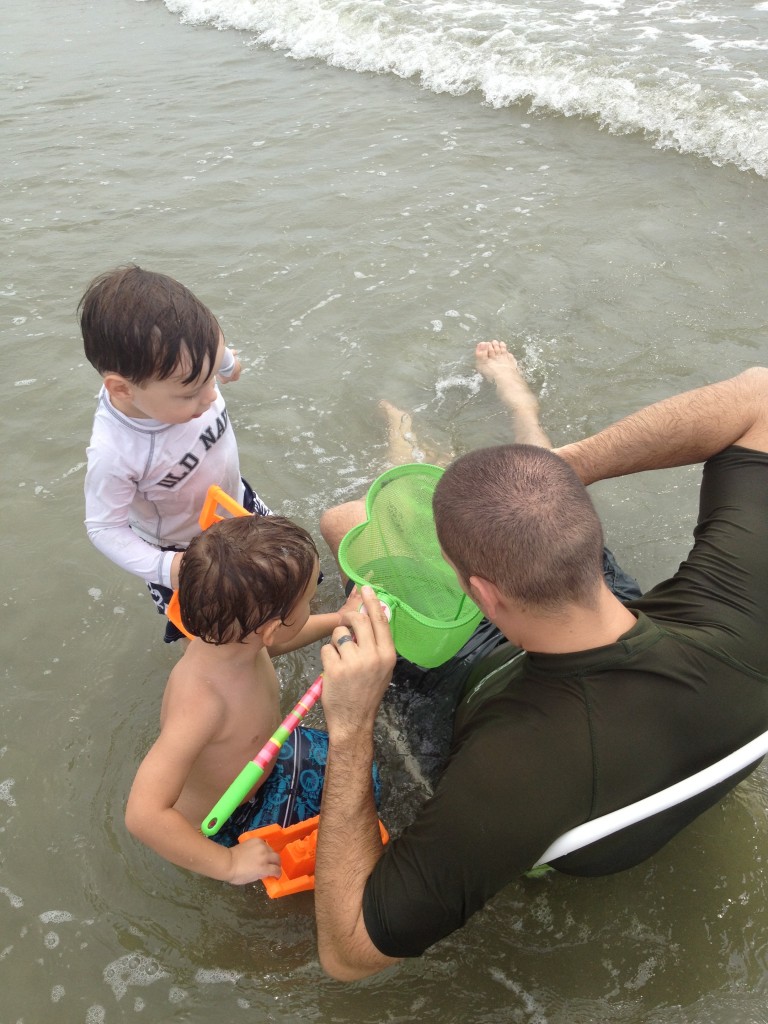 Checking out the latest catch (minnows, with the occasional crab)