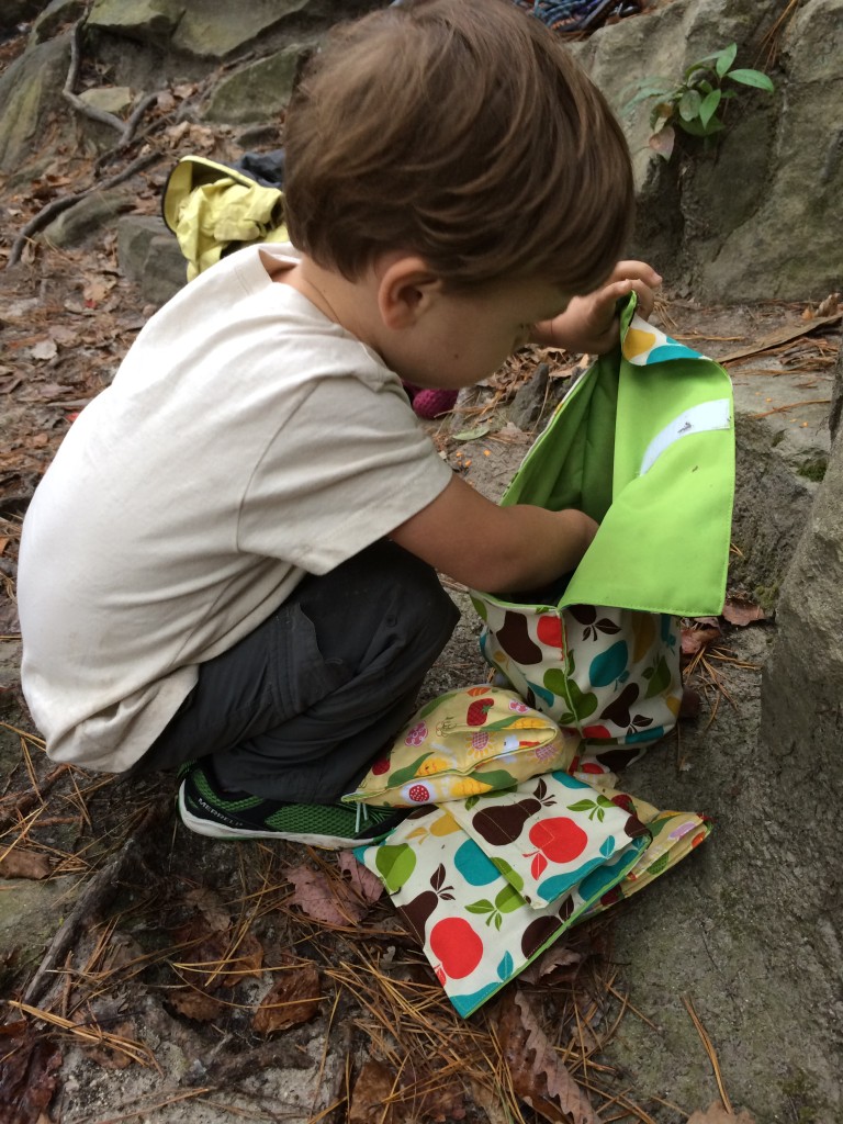 C digging through our homemade collection of bags to find the perfect crag snack!