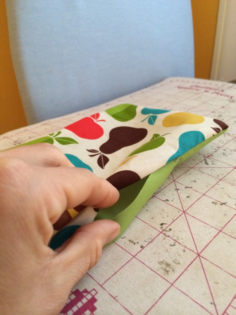 Folding the raw edges under in step 4.