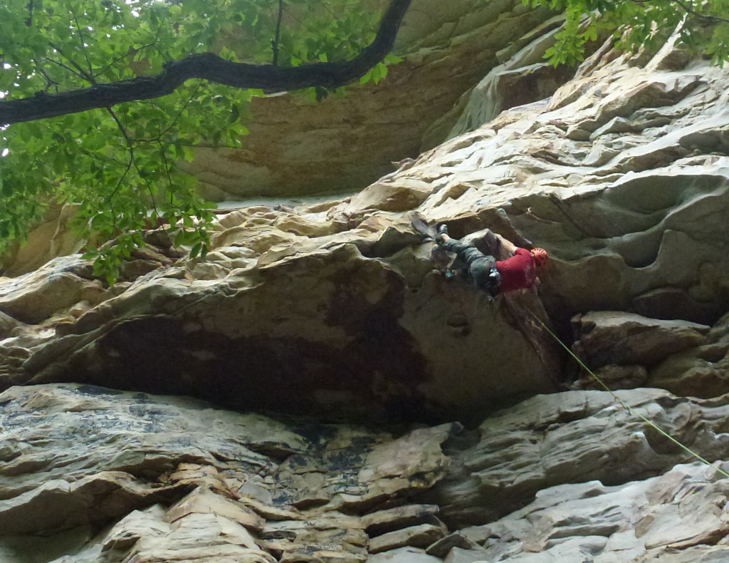 Steve mid-crux on The Rail (5.11c)