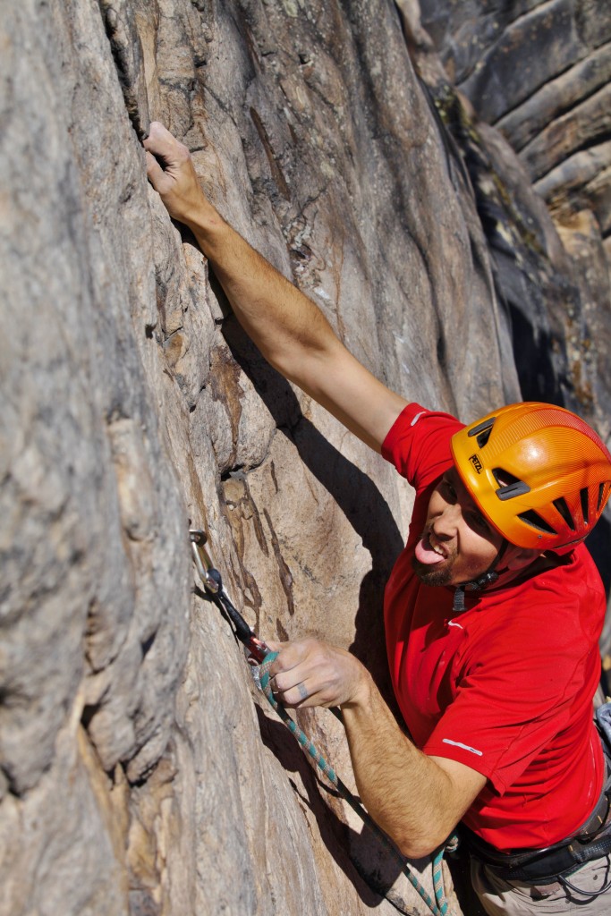 Crag Daddy getting serious on Michelin Man 5.12b)...sun's out, tongue's out, I guess!