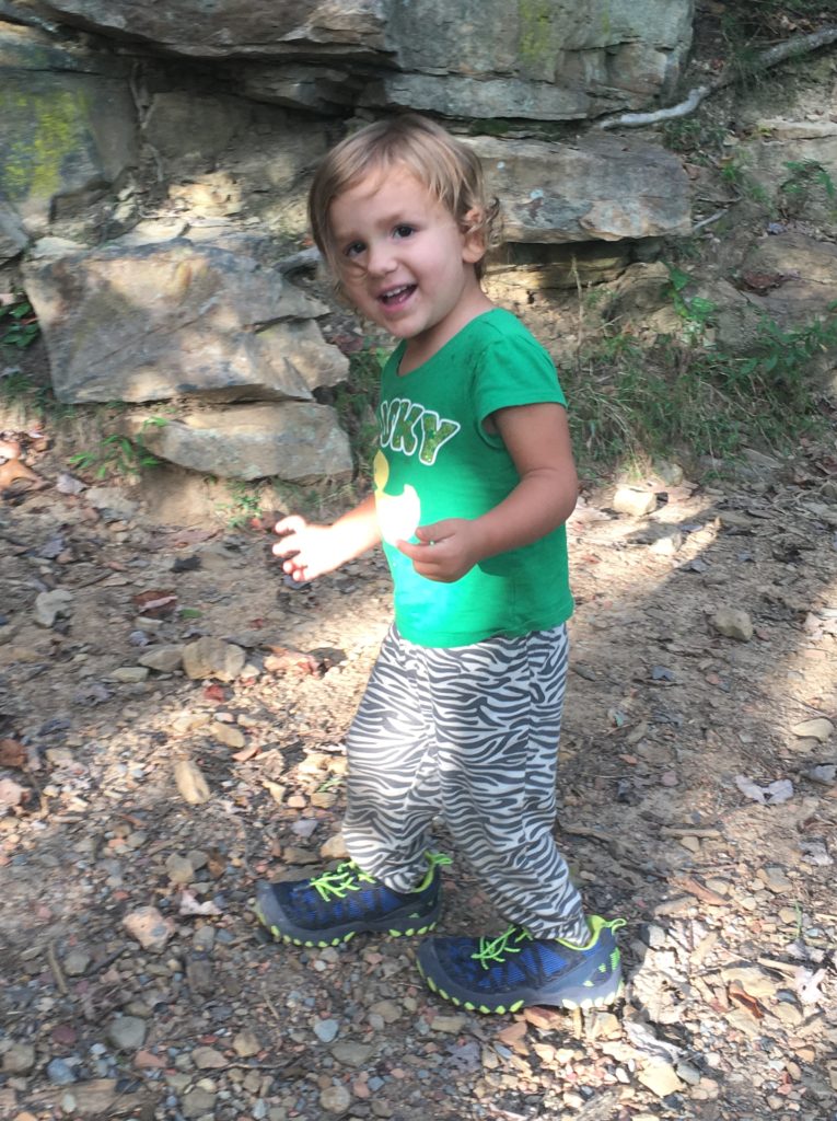 Trying to sneak away with big brothers shoes...