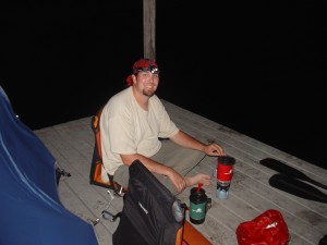 Steve cooking ramen noodles by moonlight (and headlamp) on our chickee in the middle of the Everglades.