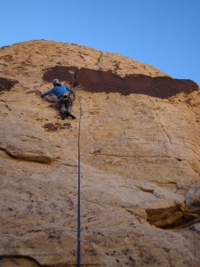 Steve preparing for the crux on Trigger Happy (5.10a)